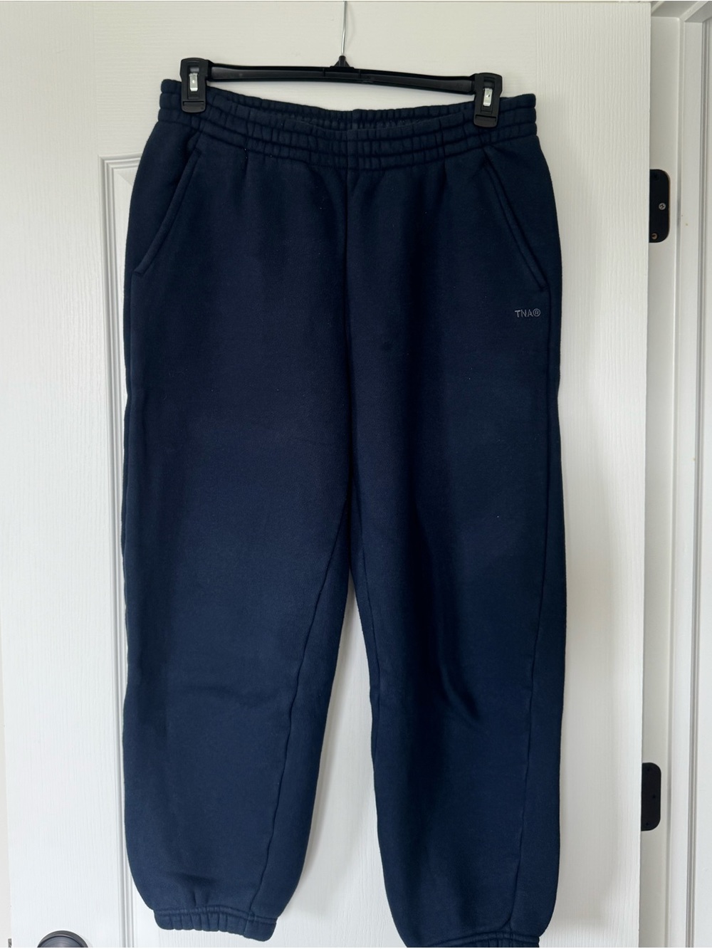 Aritzia TNA bubble boyfriend fit navy sweatpants.